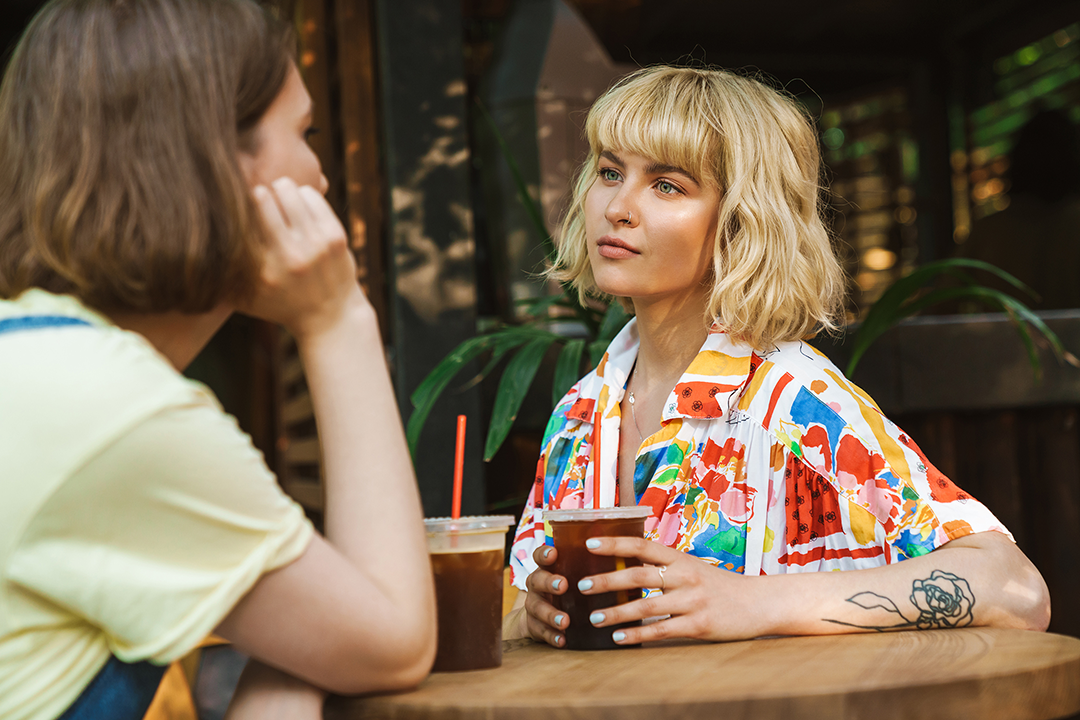 Two women talking over coffee