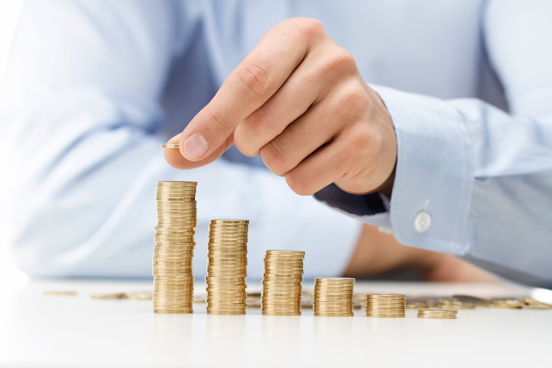 Man stacking coins