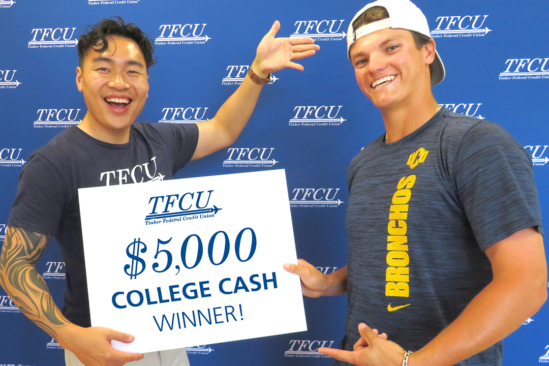 TFCU employee standing with a student while holding a sign that says $5,000 college cash winner