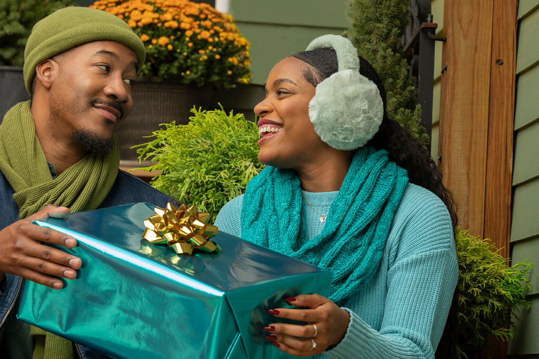 A man giving a woman a present